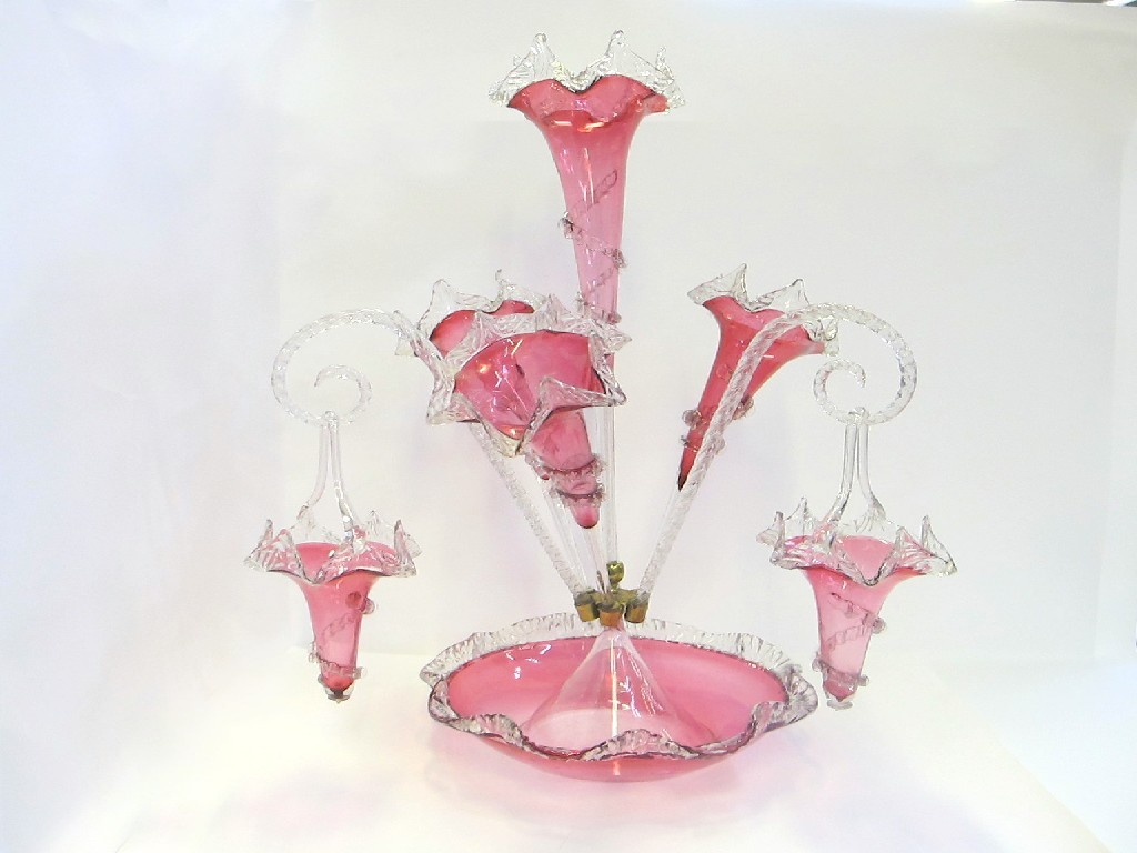 Appraisal: Cranberry glass epergne with four flutes three canes and baskets