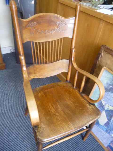 Appraisal: AN AMERICAN OAK AND BENTWOOD OPEN ARMCHAIR with label beneath