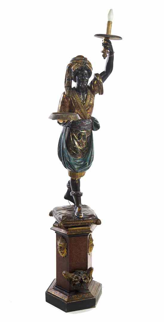 Appraisal: A Venetian Painted and Parcel Gilt Figural Torchiere depicting a