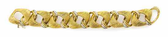 Appraisal: An Karat Yellow Gold and Diamond Fluted Link Bracelet containing