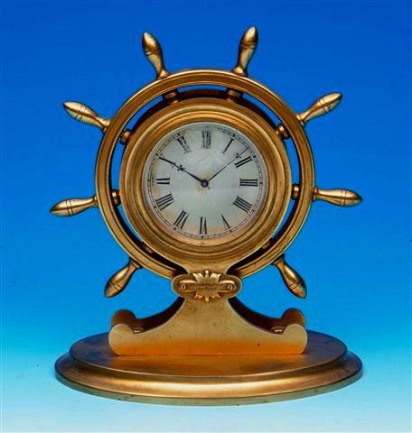 Appraisal: A Victorian gilt metal ship's wheel timepiece with silvered Roman