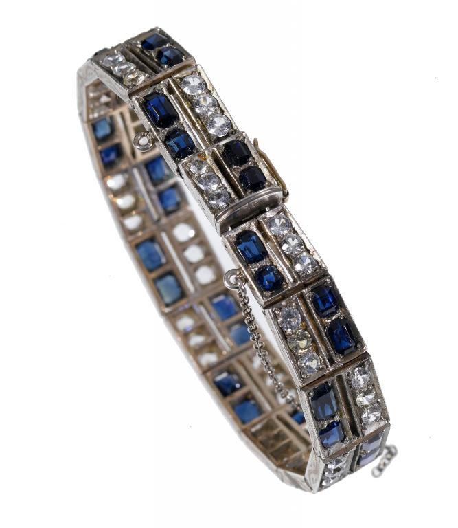 Appraisal: A SAPPHIRE AND WHITE SAPPHIRE BRACELET of sixteen panels including