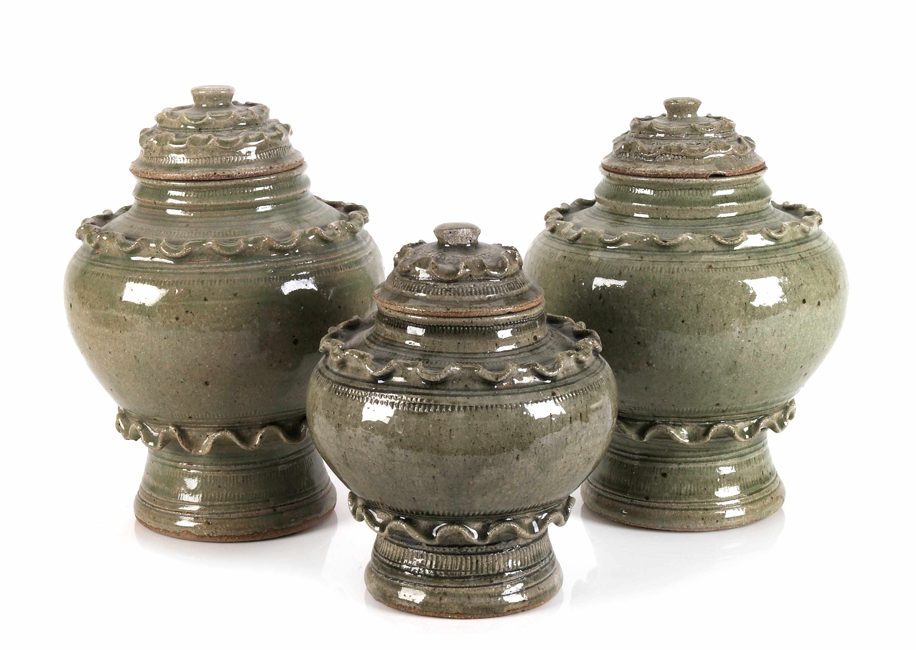 Appraisal: A pair of Thai reproduction celadon glazed stoneware jars and