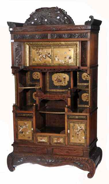 Appraisal: A JAPANESE SHIBIYAMA AND CARVED WOOD CABINET with dragon frieze