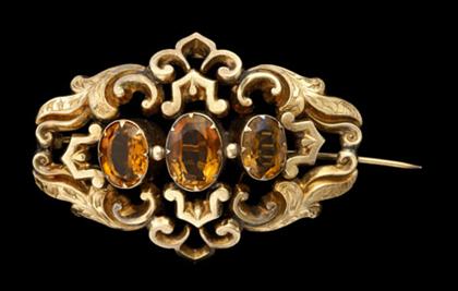 Appraisal: Gold fill and citrine filigree pendant Three oval cut citrines