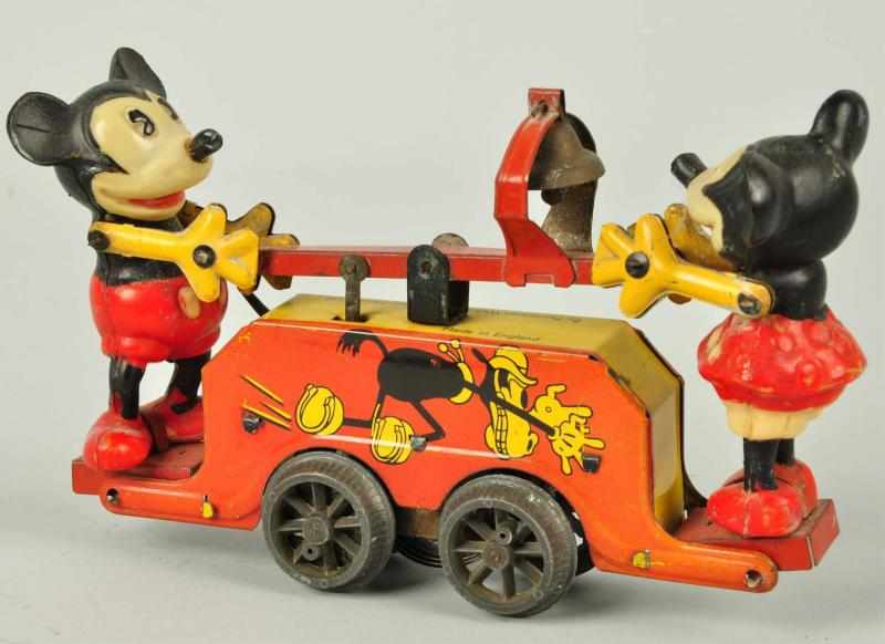 Appraisal: Tin Wells Mickey Minnie Handcar Wind-Up Toy Description English Working