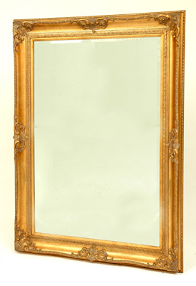 Appraisal: A VICTORIAN STYLE GILT WOOD OVERMANTEL MIRROR The rectangular bevelled