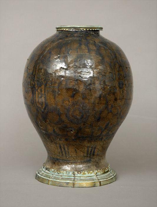 Appraisal: Turkish Blue and White Pottery Vase with Gilt-Metal Mounts Drilled