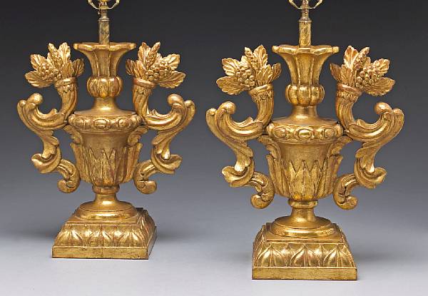 Appraisal: A pair of Italian Baroque style giltwood urns now converted