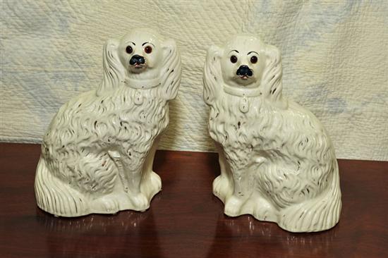 Appraisal: PAIR OF STAFFORDSHIRE DOGS White spaniels with amber eyes and