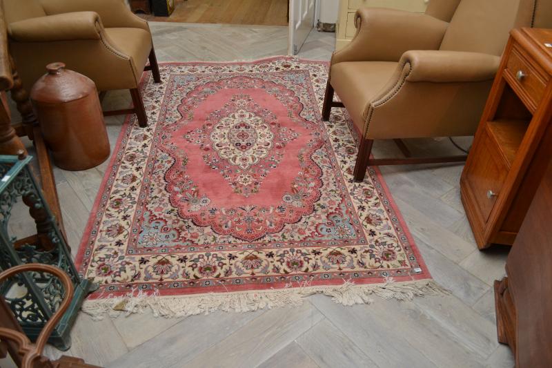 Appraisal: A PERSIAN RUG IN LIGHT MAUVE BLUE AND CREAM TONES