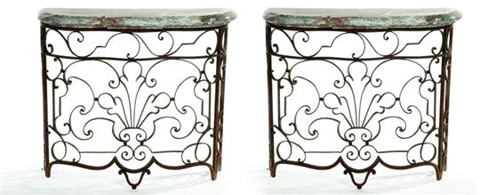 Appraisal: PAIR OF CONSOLE TABLES Twentieth century wrought iron and marble