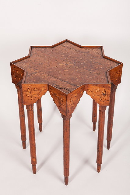 Appraisal: A DAMASCUS MARQUETRY INLAID STAR OCCASIONAL TABLE with simple scrolling