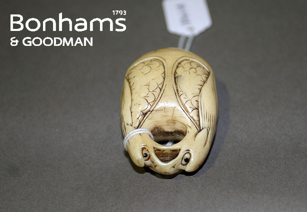 Appraisal: A Japanese bell shaped netsuke in caved ivory decorated with