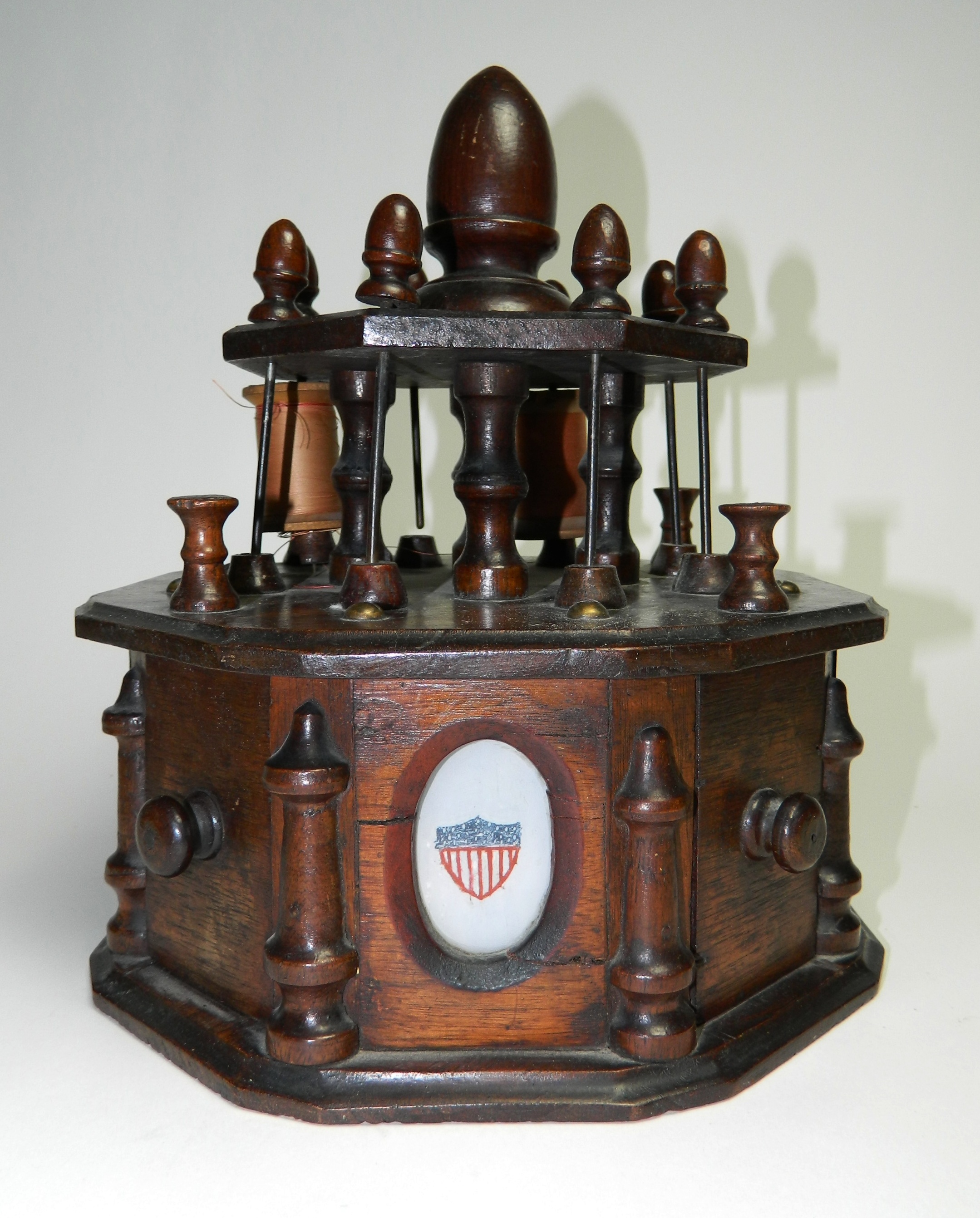 Appraisal: Victorian walnut sewing cabinet and spool holder two tier octagonal