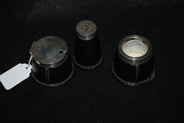 Appraisal: A THREE PIECE CONDIMENT SET with silver mounts and Doulton