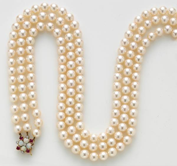 Appraisal: A cultured pearl opal and ruby triple strand necklace with