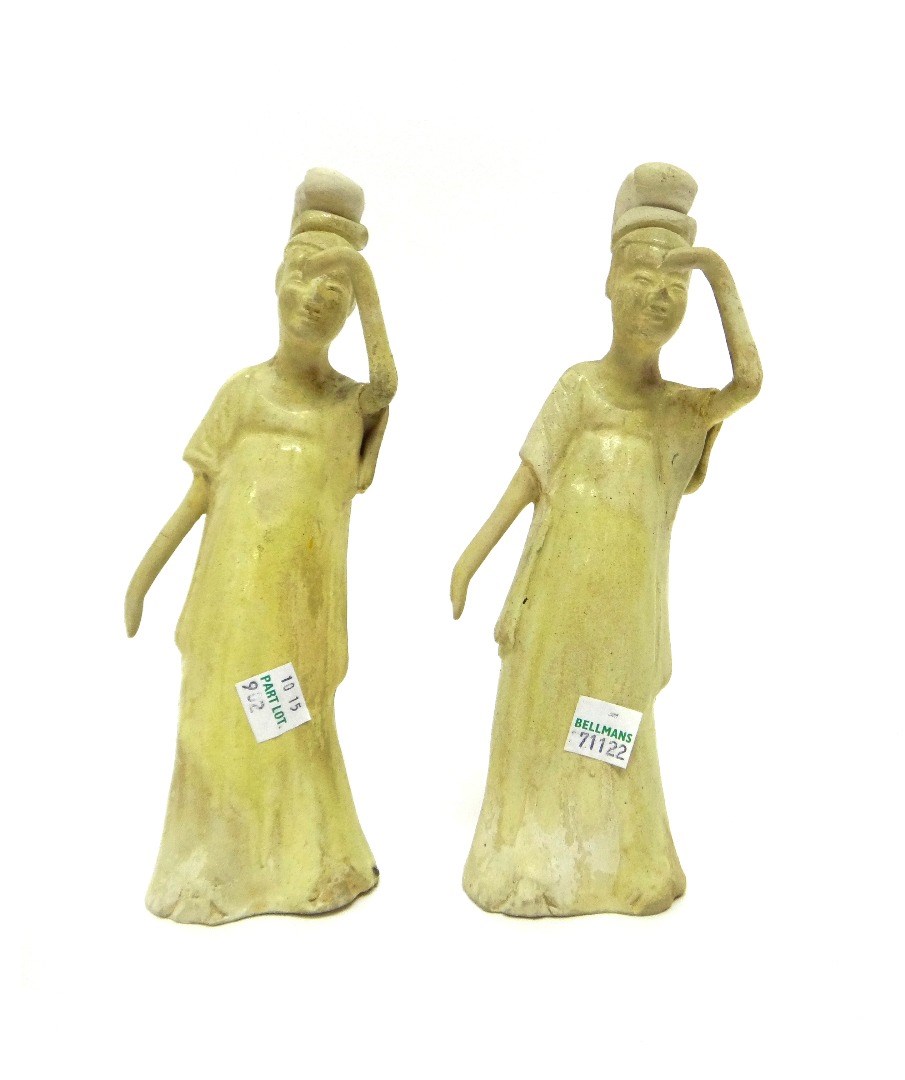 Appraisal: Two Tang style straw-glazed ladies each standing in long robes