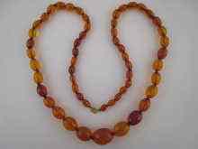 Appraisal: A fine antique vintage graduated faceted amber bead necklace the