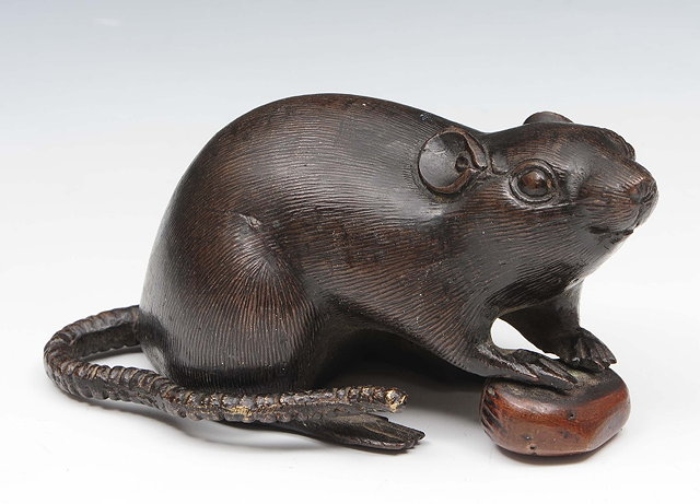 Appraisal: A Japanese bronze model ratMeiji periodthe crouched rat resting its