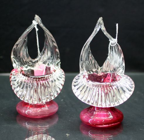 Appraisal: Pair of Victorian basket vases in cranberry glass and clear