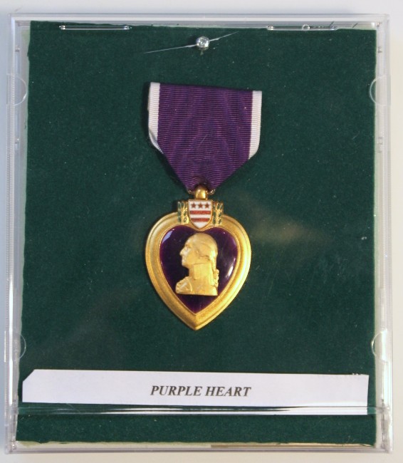 Appraisal: A Purple Heart with blue and white ribbon cm high