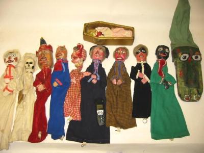 Appraisal: A Punch and Judy set comprising eleven glove puppets scratch