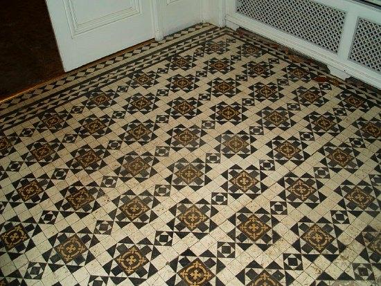 Appraisal: A tiled floor of geometric design approximately sq metres sq