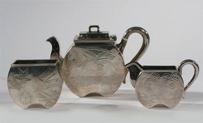 Appraisal: An Aesthetic Movement three piece electroplated tea set on diamond