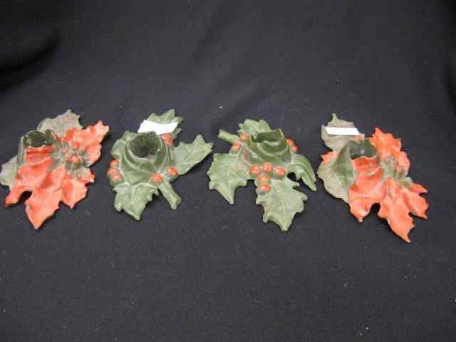 Appraisal: Pair of Cast Iron Figural Christmas Candleholdepoinsetta holly decor signed