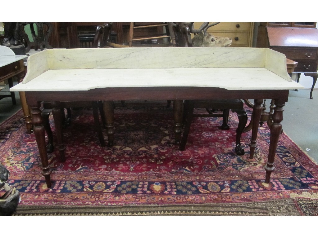 Appraisal: Victorian mahogany washstand with marble top Provenance The Property of