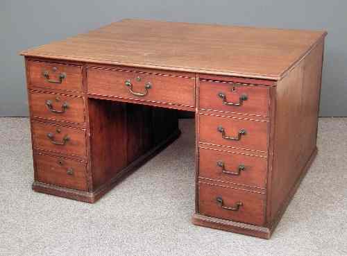 Appraisal: A George III mahogany partners desk fitted five drawers and