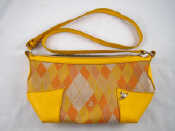 Appraisal: A Vivienne Westwood shoulder bag in yellow leather trimmed fabric