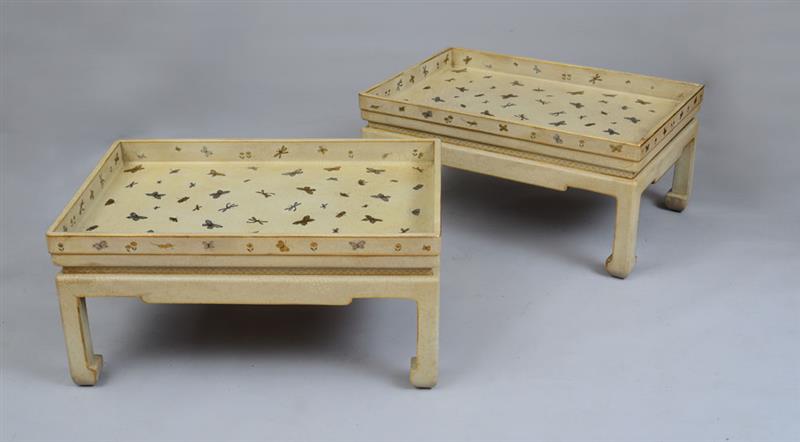 Appraisal: PAIR OF CHINESE STYLE CREAM-PAINTED AND PARCEL-GILT TRAY TOP TABLES