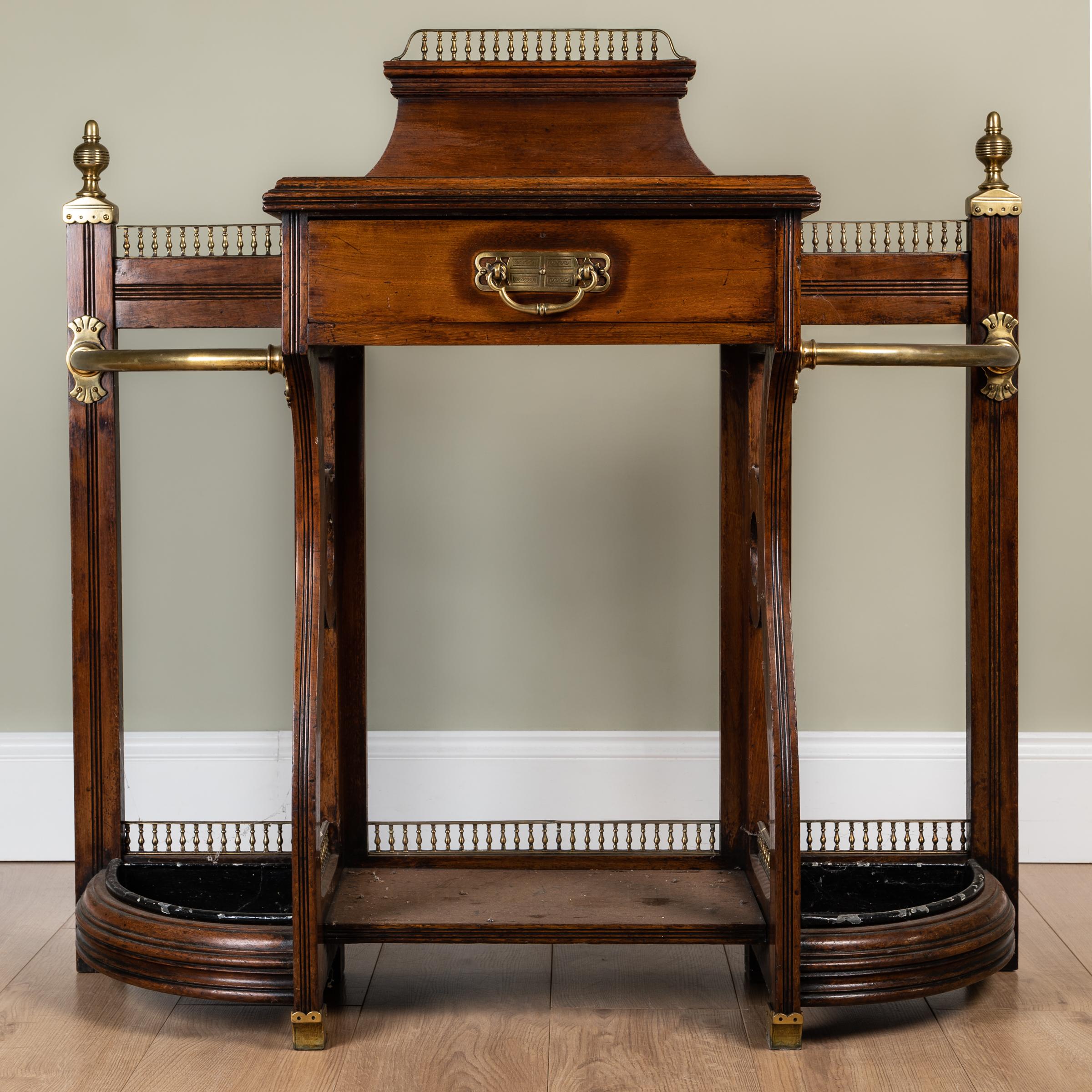 Appraisal: A late Victorian brass mounted walnut hall stand by James