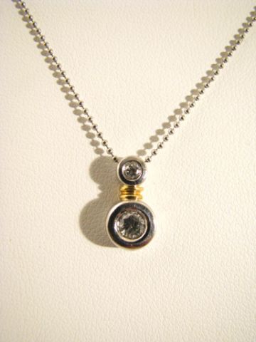 Appraisal: Platinum and K yellow gold bezel set diamond pendant with