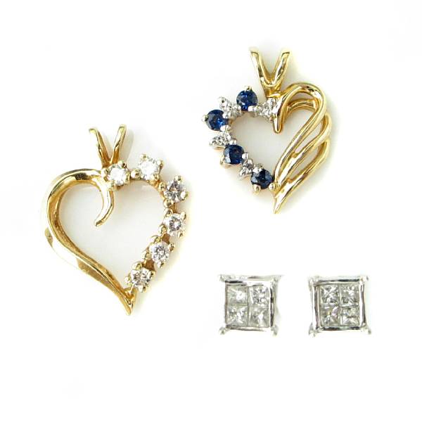 Appraisal: A collection of two sapphire diamond and gold heart pendants