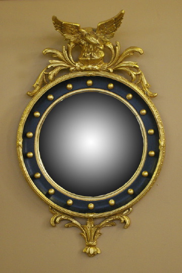 Appraisal: English Carved Parcel-Ebonized and Giltwood Convex Looking Glass in the