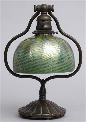 Appraisal: TIFFANY STUDIOS BRONZE DESK LAMP WITH FAVRILE GLASS SHADE Base