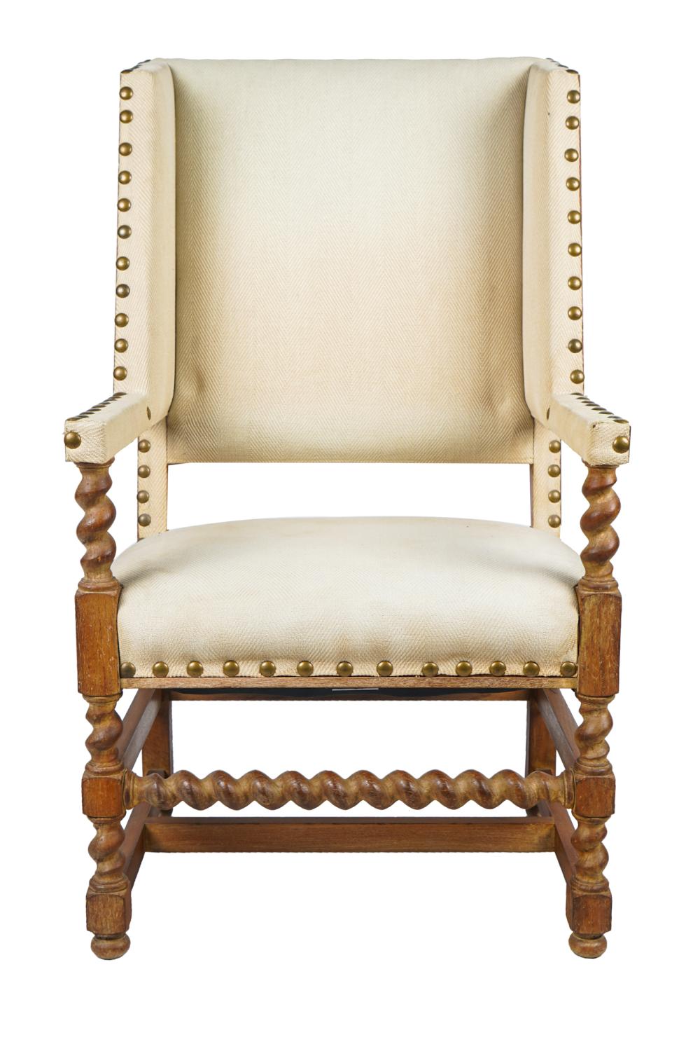 Appraisal: JEAN MASCHERONI CARVED OAK WING CHAIRwith beige herringbone-pattern upholstery with