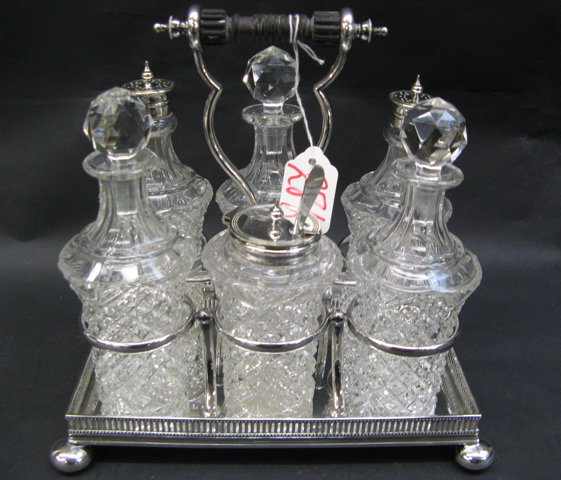 Appraisal: ENGLISH VICTORIAN SIX-BOTTLE CASTOR SET c each clear glass bottle