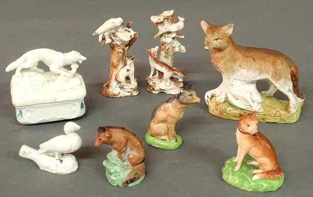 Appraisal: Six porcelain fox figures a covered box with fox lid