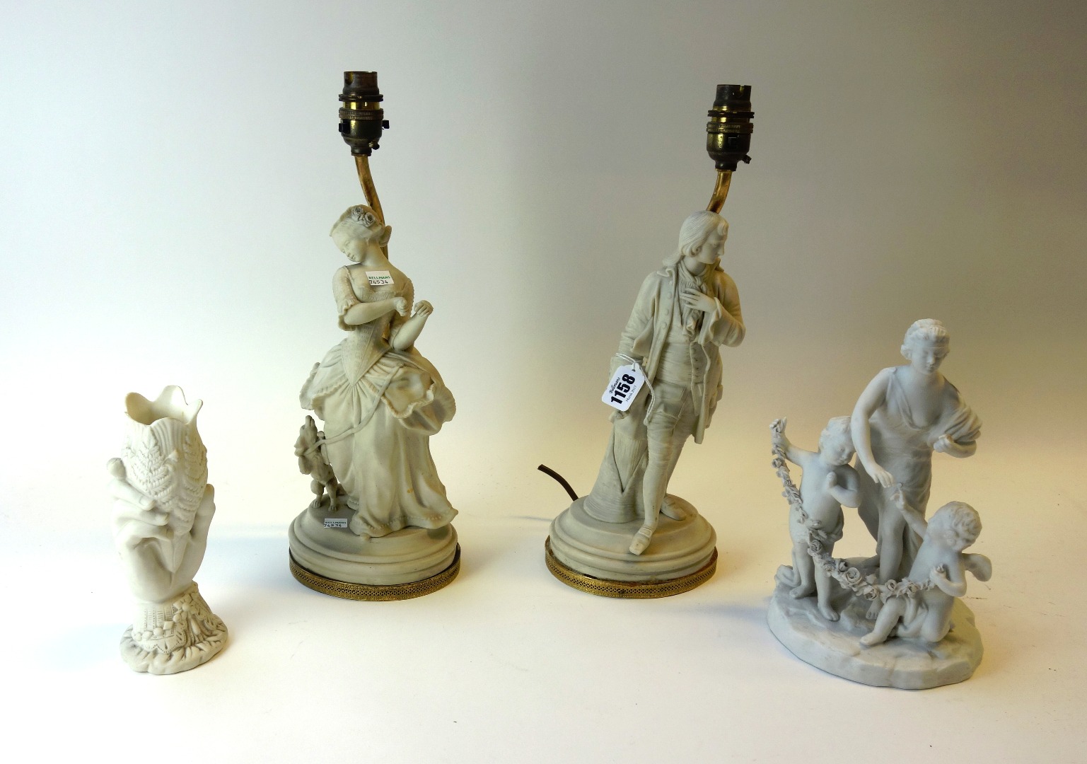 Appraisal: A pair of parian figures late th century modelled as