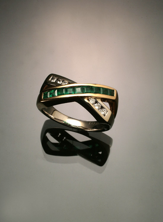 Appraisal: -Karat Yellow-Gold Diamond and Emerald Dinner Ring The channel mount