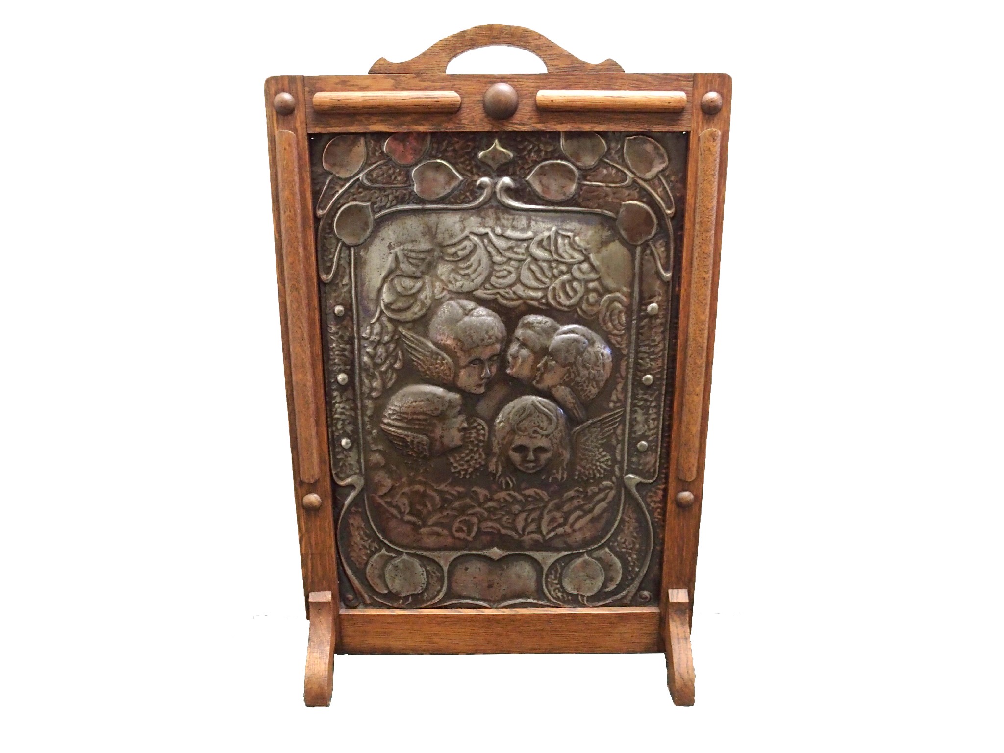 Appraisal: An Arts and Crafts hammered metal and oak firescreendecorated with