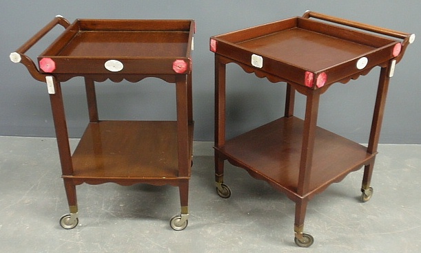 Appraisal: - Pair of mahogany tea trolleys by Baker with Bakelite