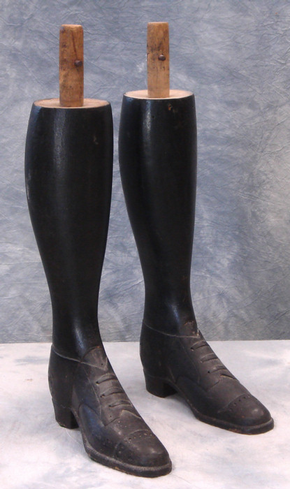 Appraisal: Pr carved black painted wood legs with lace up shoes