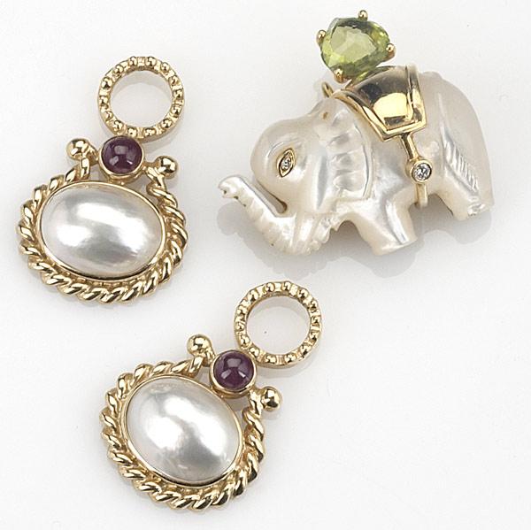 Appraisal: MOTHER OF PEARL ELEPHANT BROOCH Gem-set gold brooch with pair