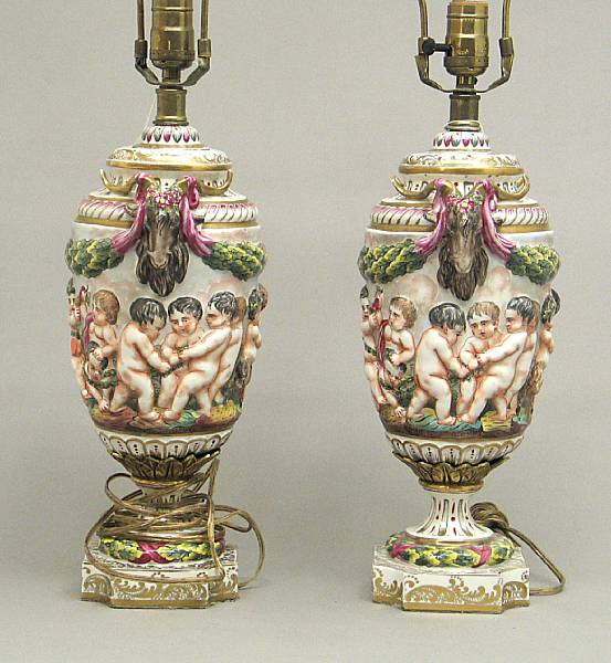 Appraisal: A pair of Capodimonte style porcelain urns converted to table