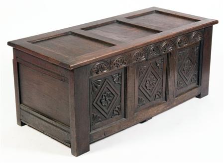 Appraisal: A th century style oak blanket chest the tree panelled